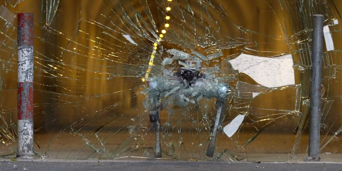 Unitree A2 breaking through a glass pane